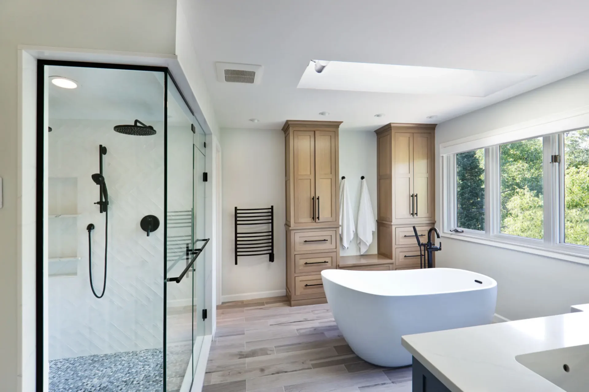 Spacious bathroom featuring glass shower