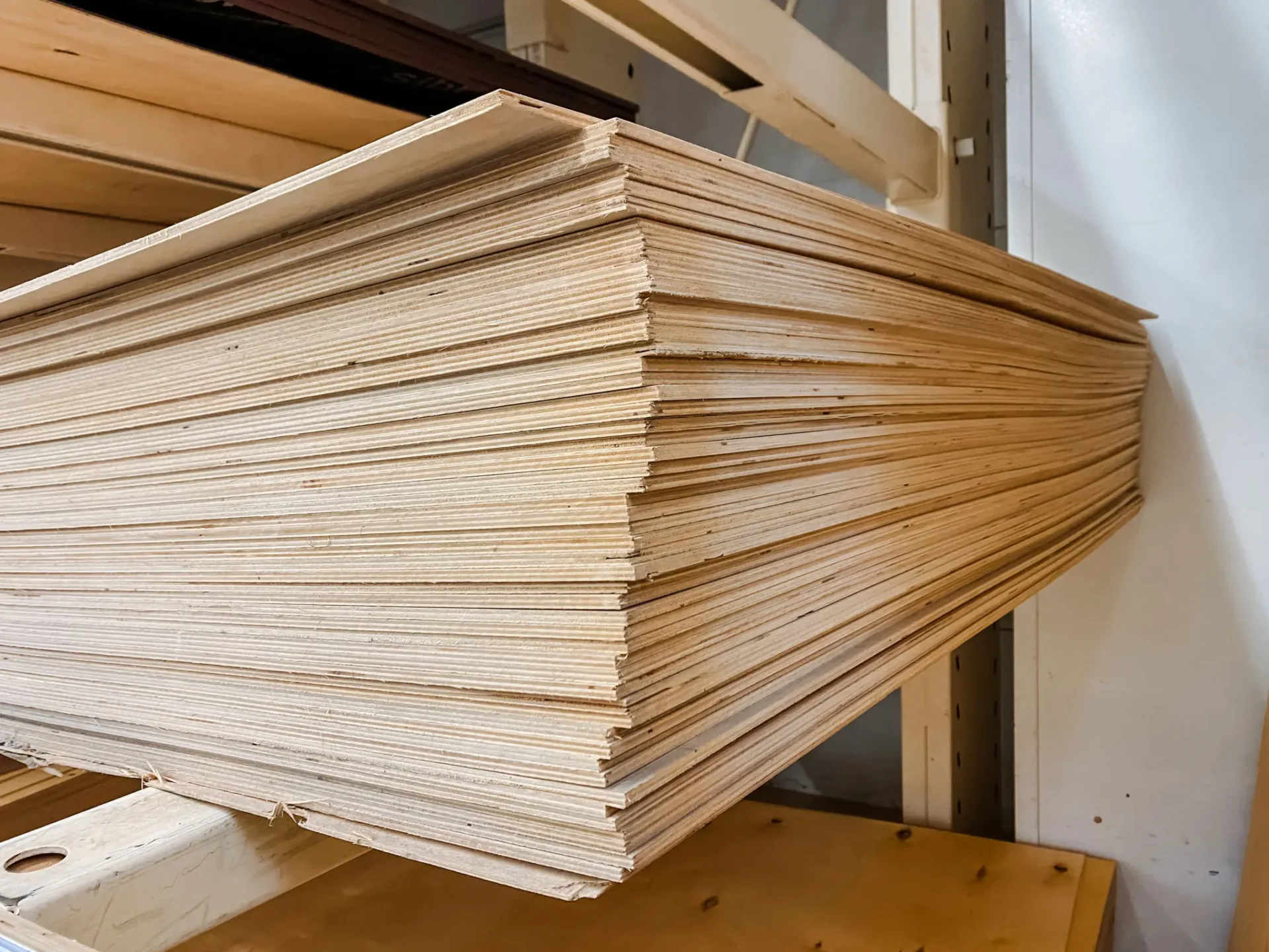 Plywood stacked neatly on shelf