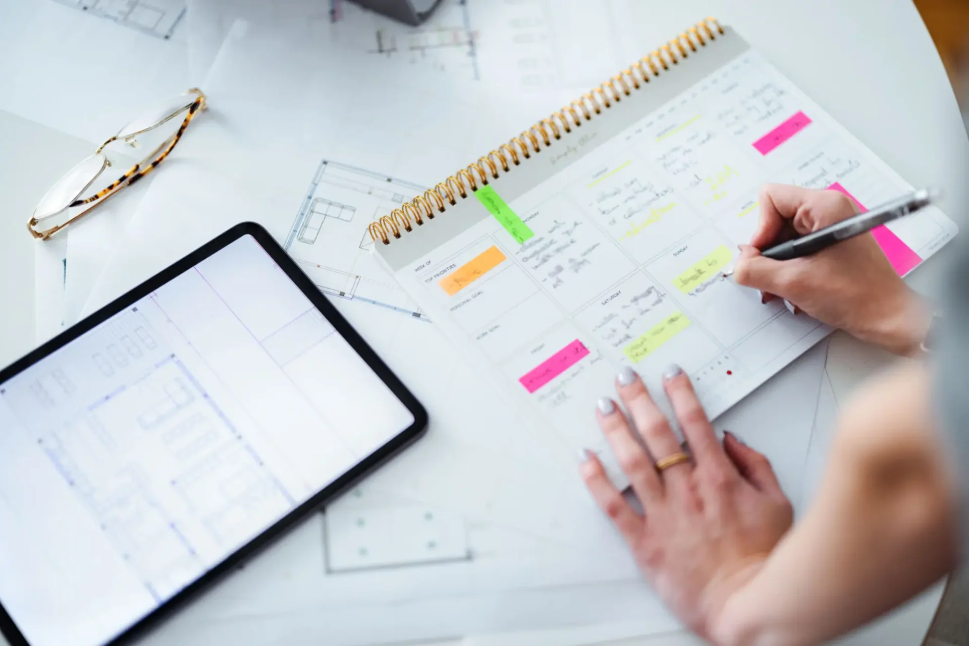 Planning schedule with notes and tablet