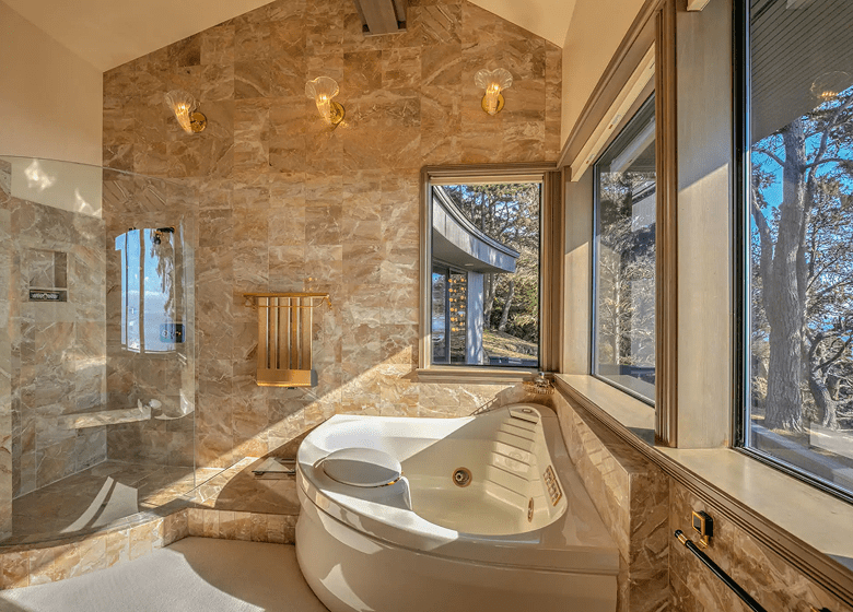 Sunlit bathroom with large windows
